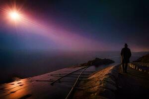 un' uomo sta su un' scogliera prospiciente il oceano a notte. ai-generato foto