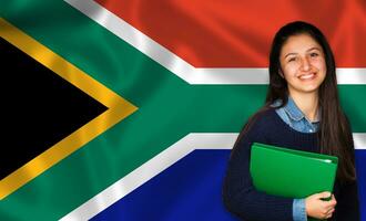 adolescente alunno sorridente al di sopra di Sud africano bandiera foto