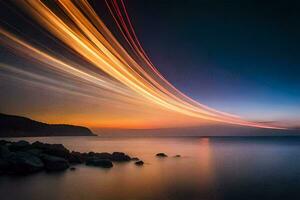 un' lungo esposizione fotografia di un' lungo linea di leggero sentieri al di sopra di il oceano. ai-generato foto