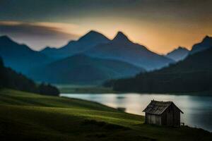 un' piccolo cabina si siede su il bordo di un' lago a tramonto. ai-generato foto