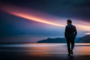 un' uomo nel un' completo da uomo passeggiate lungo il spiaggia a tramonto. ai-generato foto