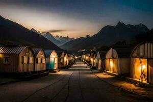 un' riga di piccolo case nel il montagne a notte. ai-generato foto