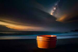 un' secchio su il spiaggia a notte con un' cielo pieno di stelle. ai-generato foto