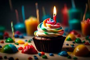 un' Cupcake con un' candela su superiore circondato di colorato caramelle. ai-generato foto