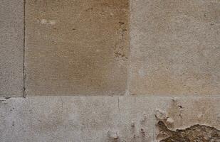 beige struttura pietra parete. vecchio castello pietra parete ruvido superficie sfondo.an inglese patrimonio mattone parete con grunge foto