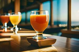 tre bicchieri di arancia succo su un' di legno tavolo. ai-generato foto