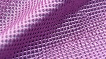 viola calcio tessuto struttura con aria maglia. atletico indossare fondale foto