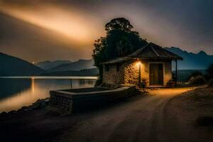 un' piccolo capanna si siede su il lato di un' lago a crepuscolo. ai-generato foto