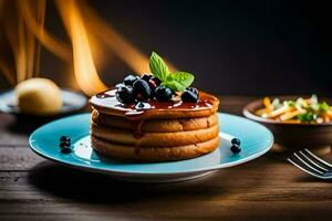 Pancakes con mirtilli e sciroppo su un' blu piatto. ai-generato foto