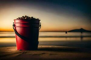 un' rosso secchio pieno con noccioline su il spiaggia a tramonto. ai-generato foto