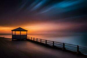 un' gazebo su il spiaggia a tramonto. ai-generato foto