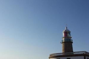 faro di corrubedo nell'oceano atlantico, galizia, spagna foto