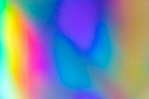 astratto sfocatura olografico arcobaleno Foglio iridescente sfondo foto