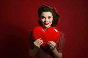 ritratto di un' contento donna con rosso cuore su un' rosso background.valentine's giorno concetto ai generato foto