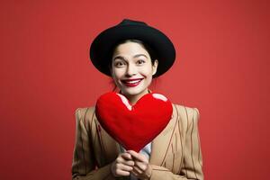 ritratto di un' contento donna con rosso cuore su un' rosso background.valentine's giorno concetto ai generato foto