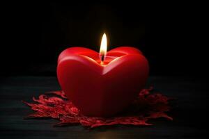 rosso cuore sagomato candela su nero sfondo. San Valentino giorno concetto. ai generato foto