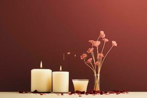 tre ardente candele con secco fiori su un' rosso sfondo con copia spazio ai generato foto