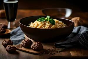 un' ciotola di pasta con noccioline e un' bicchiere di birra. ai-generato foto