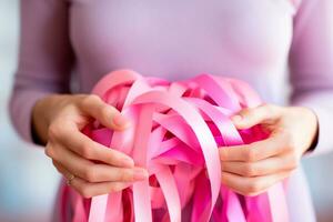 rosa ottobre - donna Tenere nastri nel rosa toni, un' simbolo di consapevolezza per il presto rivelazione di Seno cancro.insieme, noi siamo più forte. noi volontà battere Seno cancro. ai generativo foto