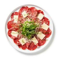 ai generato carpaccio di Manzo con parmigiano trucioli Natale o nuovo anno piatto superiore Visualizza isolato su bianca sfondo foto