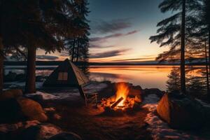 ai generato campeggio su il riva di il lago nel il inverno a tramonto, un' campo di il lago con un' fuoco di bivacco nel inverno a crepuscolo, ai generato foto