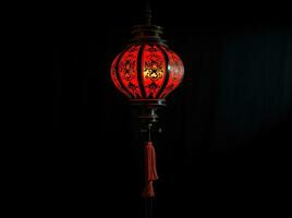 ai generato rosso e oro Cinese lanterne isolato su nero sfondo. asiatico nuovo anno rosso lampade Festival ai generativo foto