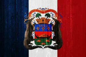 bandiera e cappotto di braccia di Guiana Dipartimento di Francia su un' strutturato sfondo. concetto collage. foto