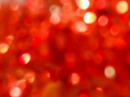 sfocato e bokeh rosso riflessione di Natale decorato sfondo e sfondo. foto