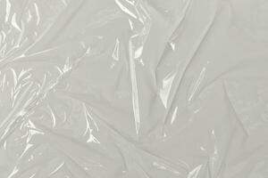 plastica trasparente cellofan Borsa su bianca sfondo. bianca plastica film avvolgere struttura sfondo. bianca plastica Borsa struttura foto