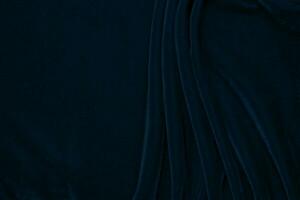 pendenza buio blu velluto tessuto struttura Usato come sfondo. Marina Militare colore tessuto sfondo di morbido e liscio tessile Materiale. schiacciato velluto .lusso blu tono per seta. foto