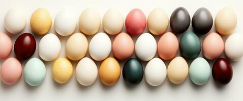 ai generato colorato Pasqua uova nel arcobaleno, floreale disposizione, e bianca sfondo foto