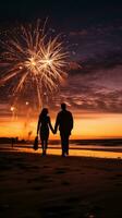 ai generato silhouette di un' coppia a piedi mano nel mano su il spiaggia con fuochi d'artificio illuminazione su il notte cielo foto