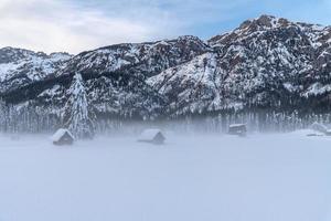 dopo la nevicata. ultime luci del crepuscolo a sappada. magia delle dolomiti foto