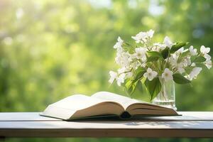 ai generato gelsomino fiori nel un' vaso e Aperto libro su il tavolo, verde naturale sfondo. ai generato foto