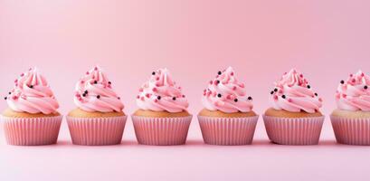 ai generato cupcakes con rosa glassa siamo nel un' riga su un' rosa sfondo foto