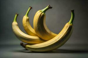 ai generato mazzo di banane su un' grigio sfondo. salutare cibo concetto. ai generato foto