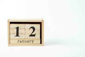 di legno calendario gennaio 12 su un' bianca sfondo foto