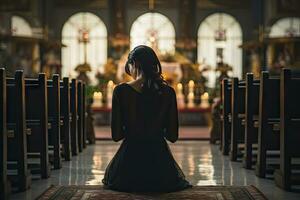 ai generato giovane religioso donna preghiere nel cattolico Cattedrale foto