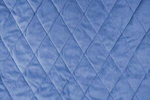 trapuntato blu velours tessuto sfondo, rugosa morbido coperta superficie foto