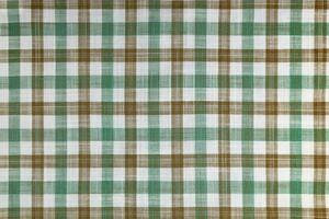 verde e Marrone scacchi struttura tessuto, tartan modello sfondo. foto