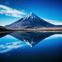 ai generato cattura il sereno bellezza di un' vulcanico montagna riflessa nel un' calma, cristallino lago foto