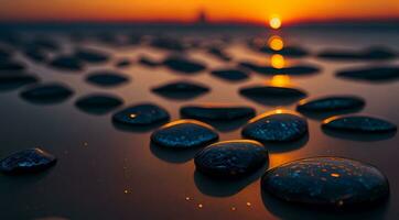 ai generato liscio pietre nel un' linea su un' spiaggia a tramonto con riflessi vivace cielo colori generativo di ai foto