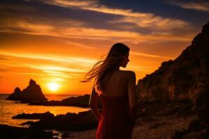 ai generato silhouette di un' ragazza nel un' rosso vestito a tramonto su il spiaggia, epico rosso tramonto nel cala llentrisca con un' modello, ibiza, ai generato foto