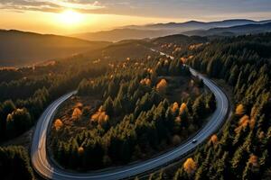 ai generato aereo Visualizza di montagna strada nel foresta a tramonto nel autunno. superiore Visualizza a partire dal fuco di strada nel boschi. bellissimo paesaggio con carreggiata nel colline, pino alberi, verde prati foto