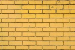 sfondo di muro di mattoni gialli foto