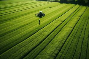 ai generato assunzione cura di il Ritaglia. aereo Visualizza di un' trattore fertilizzante un' coltivato agricolo campo. foto