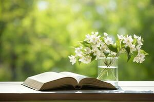 ai generato gelsomino fiori nel un' vaso e Aperto libro su il tavolo, verde naturale sfondo. ai generato foto