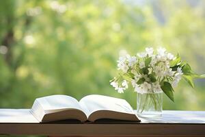 ai generato gelsomino fiori nel un' vaso e Aperto libro su il tavolo, verde naturale sfondo. ai generato foto