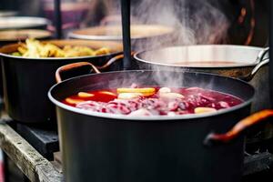 ai generato bevande frutta e frutti di bosco caldo vin brulé vino nel pentole con vapore nel strada cibo mercato. generativo ai foto