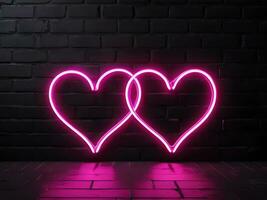 paio di neon cuori su mattone parete amore simbolo foto